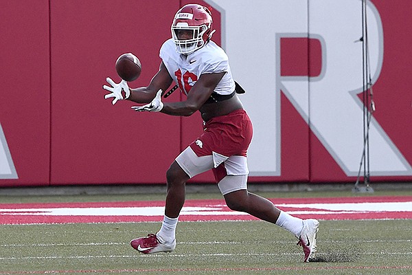 Arkansas receiver Treylon Burks catches a pass during practice Monday, Aug. 24, 2020, in Fayetteville.