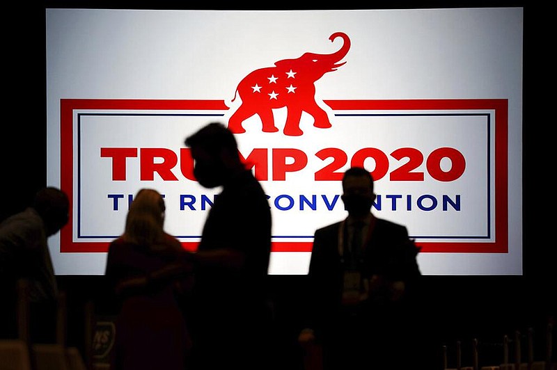 The room is set and delegates begin to arrive for the first day of the Republican National Convention, Monday, Aug. 24, 2020, in Charlotte, N.C.  (Travis Dove/The New York Times via AP, Pool)