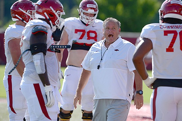 Arkansas coach Sam Pittman directs members of the offensive line Tuesday, Aug. 25, 2020, during practice at the university practice facility in Fayetteville.