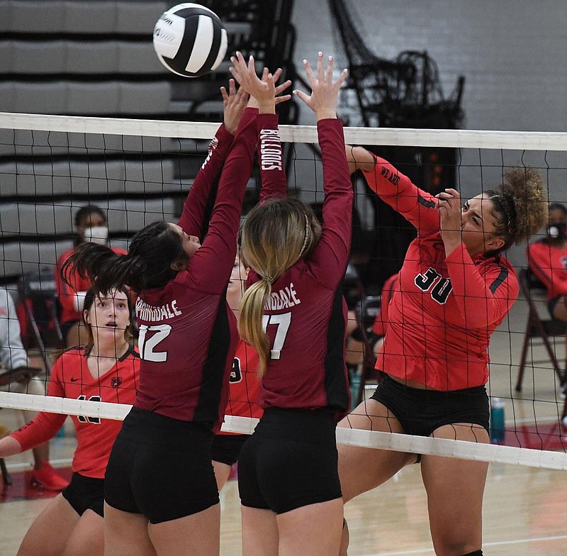 Springdale's Nathalie Calderon (12) and Hannah Ogle try to block a shot by Fort Smith Northside's Dynasty Andrews Tuesday Aug. 25, 2020 at FHS. Visit https://nwamedia.photoshelter.com/ for a gallery of images. (NWA Democrat-Gazette/J.T.WAMPLER)  