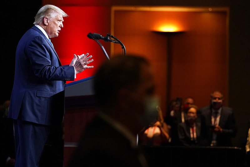 FILE - In this Aug. 24, 2020, file photo President Donald Trump speak at the 2020 Republican National Convention in Charlotte, N.C. Though Trump has been president for three-and-a-half years, his rhetoric on the state of the nation has remained bleak. And as he prepares to deliver his second acceptance speech on Thursday, Aug. 26, the president faces a country in crisis, one gripped by a once-in-a-century pandemic, a battered economy, racial reckoning and a massive hurricane taking aim at the Gulf Coast. (AP Photo/Andrew Harnik, File)

