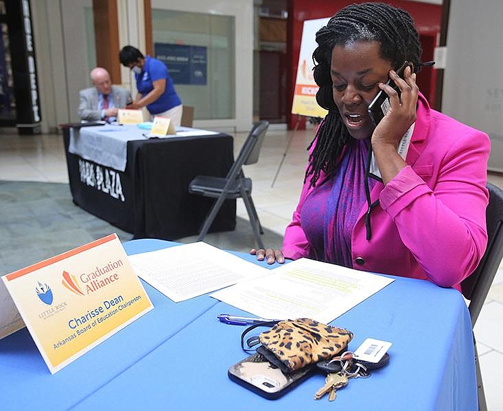 Charisse Dean, chairwoman of the Arkansas Board of Education, makes phone calls Wednesday at Park Plaza Mall in Little Rock, contacting students who stopped attending high school. A new partnership between the Little Rock School District and Graduation Alliance aims to get those students back on track to complete their schooling.
(Arkansas Democrat-Gazette/Thomas Metthe)