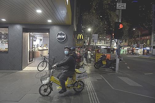 A food delivery courier arrives to pick up an order from a McDonald’s restaurant in Melbourne, Australia, last month. The company’s board of directors has hired lawyers to help in the investigation into its human resources department and former CEO.
(Bloomberg News/Carla Gottgens)