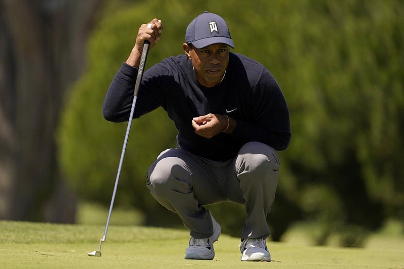 Tiger Woods lines up a putt on the third hole during the second round of the PGA Championship golf tournament at TPC Harding Park Friday, Aug. 7, 2020, in San Francisco. (AP Photo/Jeff Chiu)