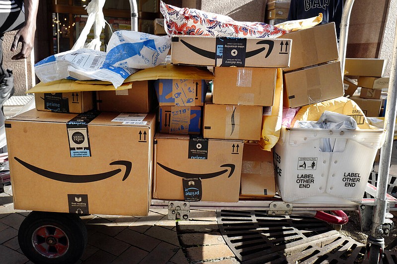 Amazon Prime boxes are loaded on a cart for delivery in New York in this Oct. 10, 2018, file photo.