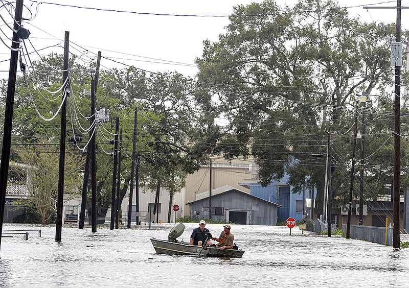 Boaters navigate a flooded road following Hurricane Laura, Thursday, Aug. 27, 2020 in Delcambre, La. (Brad Bowie/The Advocate via AP)
story.lead_photo.caption