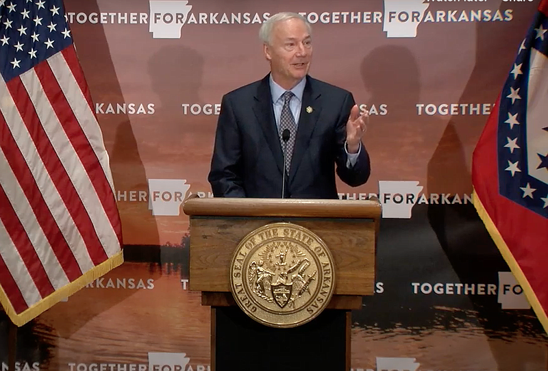 Arkansas Gov. Asa Hutchinson speaks to reporters at the state Capitol in Little Rock on Friday in this still of video provided by the governor's office. 
