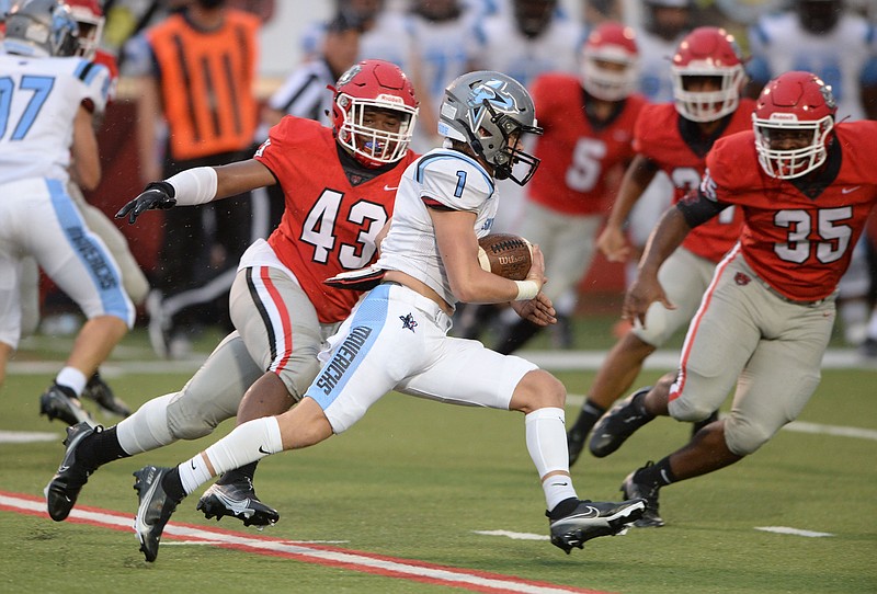 Fort Smith Northside's Demaris Medlock (43) and Kendre Esaw (35) track down Fort Smith Southside's Eli Lyles (1) Thursday, Aug. 27, 2020, as Lyles carries the ball after fielding a kickoff during the first half of play at Mayo-Thompson Stadium in Fort Smith. Visit nwaonline.com/200828Daily/ for today's photo gallery.
(NWA Democrat-Gazette/Andy Shupe)