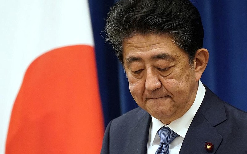 “It is gut-wrenching to have to leave my job before accomplishing my goals,” Japanese Prime Minister Shinzo Abe said Friday in Tokyo. More photos at arkansasonline.com/829japan/.
(AP/Franck Robichon)