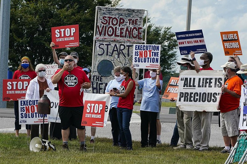 Anti-death penalty protesters gather across from the federal prison complex in Terre Haute, Ind., where Keith Dwayne Nelson was executed Friday.
(AP/Michael Conroy)