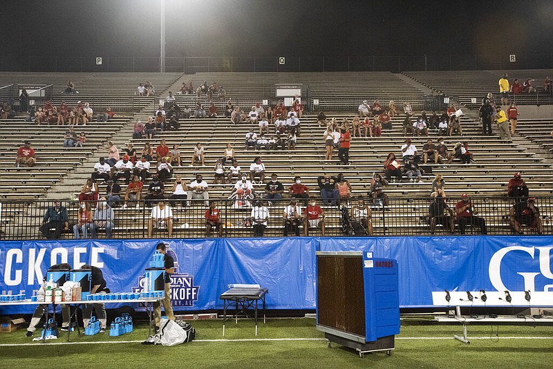 Fans sit in the stands in Montgomery, Ala., as Austin Peay hosts the University of Central Arkansas for an NCAA college football game on Saturday, Aug. 29, 2020.