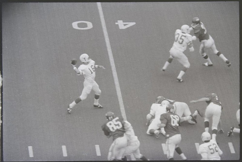 Texas quarterback James Street throws a 39-yard pass to Randy Peschel on fourth-and-3 in the fourth quarter against Arkansas on Dec. 6, 1969. The play, called 53 Veer Pass, was arguably the most famous college football play of the 1960s and set up the No. 1 Longhorns’ game-winning score against the No. 2 Razorbacks. 
(Shiloh Museum of Ozark History/Springdale News Collection/Jerry Biazo)