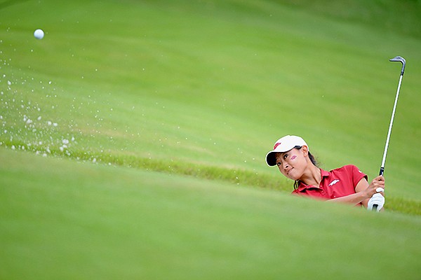 Dylan Kim of Arkansas hits onto the 13th green Tuesday, May 21, 2019, during her match with Siyun Liu of Wake Forest in the Women's NCAA Golf Championship at Blessings Golf Club in Johnson.
