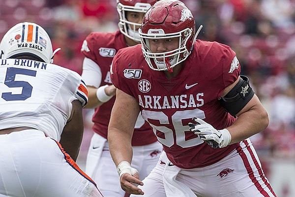 Arkansas offensive lineman Ty Clary (66) prepares to block Auburn defensive tackle Derrick Brown (5) during a game Saturday, Oct. 19, 2019, in Fayetteville.