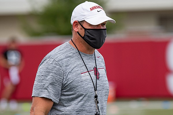 Arkansas defensive coordinator Barry Odom watches a July 2020 workout in Fayetteville.