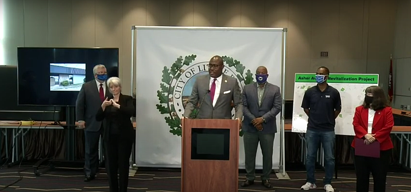 Little Rock Mayor Frank Scott Jr., along with other officials, announces a redevelopment plan for the Asher Avenue area and an incentive package that aims to spur economic development south of Interstate 630 and east of Interstate 30.