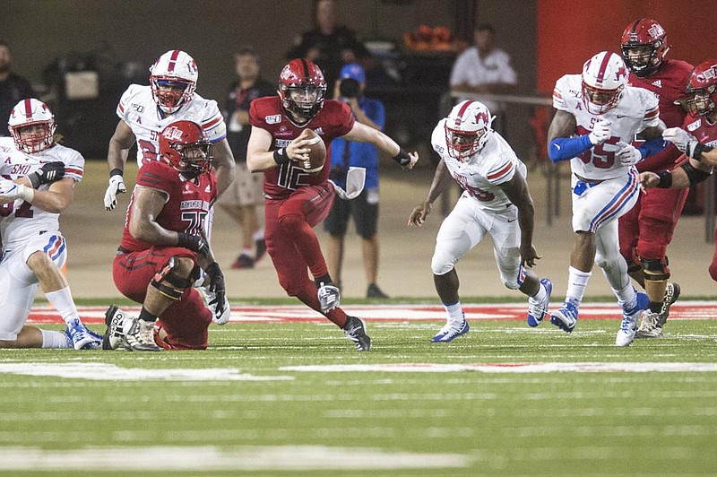 Junior Logan Bonner (center) will be Arkansas State’s starting quarterback in Saturday’s opener at Memphis, but Coach Blake An- derson and offensive coordinator Keith Heckendorf said Layne Hatcher also will play. (Democrat-Gazette file photo) 