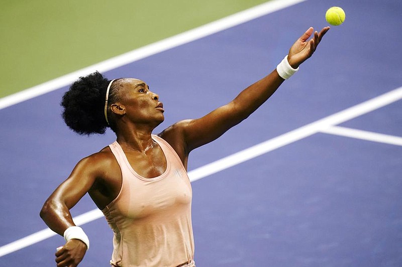 Venus Williams serves the ball Tuesday during her 6-3, 7-5 loss to No. 20-seed- ed Karolina Muchova in the rst round of the U.S. Open in Flushing Meadows, N.Y. It’s the rst time Williams has lost a rst-round match at the tournament. (AP/Frank Franklin II) 