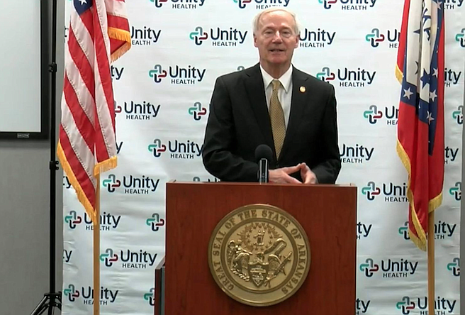 Arkansas Gov. Asa Hutchinson speaks to reporters in Searcy on Friday in this still of video provided by the governor's office. 