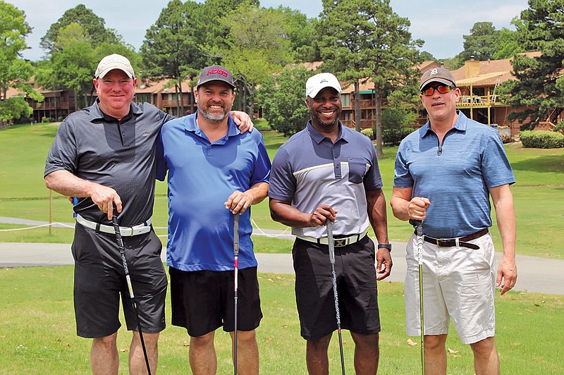 The 20th annual Paul Dunn Classic is scheduled for Sept. 14 at the Maumelle Country Club. Proceeds from the tournament will benefit families in the area who are battling amyotrophic lateral sclerosis, or ALS, through the ALS Association. The Arkansas ALS Chapter assists approximately 150 families across the state. Pictured, from left, are Blake Murchinson, Mike Compton, Rodney Peel and Tarek Shehadeh, who played in last year’s tournament.