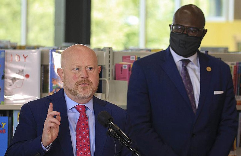 Chief Education Officer Jay Barth (left) and Mayor Frank Scott Jr. announce several key education initiatives Thursday in Little Rock during a news conference at the Hillary Rodham Clinton Children’s Library in Little Rock.
(Arkansas Democrat-Gazette/Staton Breidenthal)