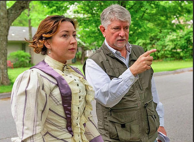 Director Larry Foley talks to actor Jennica Schwartzman who plays Ada Patterson, a reporter for the St. Louis Republic who, in 1896, interviewed Judge Isaac C. Parker, about a re-enactment scene in Foley’s new documentary “Indians, Outlaws, Marshals and the Hangin’ Judge.”