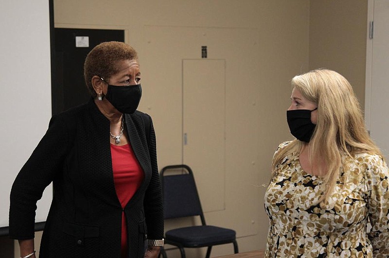 Pine Bluff Mayor Shirley Washington (left) talks with Jefferson County Office of Emergency Management Director Karen Blevins Thursday after a meeting of the emergency management board. The board approved the county purchasing a Motorola CAD software system to upgrade its emergency communications. Blevins said the current system was installed in 2007. 
(Pine Bluff Commercial/Dale Ellis)