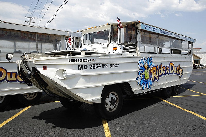 A duck boat sits idle in the parking lot of Ride the Ducks, an amphibious tour operator in Branson, Mo., in this July 20, 2018, file photo.