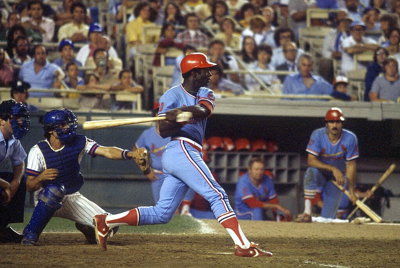 Lou Brock of the St. Louis Cardinals swings while at bat against the New York Mets in New York in this Aug. 7, 1979, file photo. Hall of Famer Brock, one of baseball’s signature leadoff hitters and base stealers who helped the Cardinals win three pennants and two World Series titles in the 1960s, has died. He was 81.