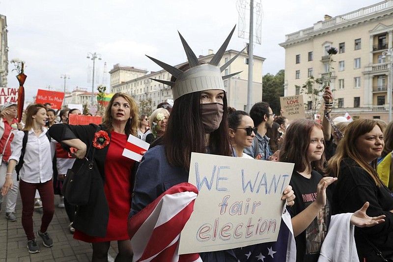 Women fill the streets in Minsk, Belarus, on Saturday to protest presidential election results. More photos at arkansasonline. com/96belarus/ (AP)