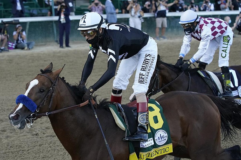 John Velazquez rides Authentic (18) across the finish line ahead of Manny Franco and Tiz the Law to win the 146th running of the Kentucky Derby at Churchill Downs on Saturday in Louisville, Ky. The two horses could meet at the Preakness on Oct. 3 in Baltimore.
(AP/Jeff Roberson) story.lead_photo.caption