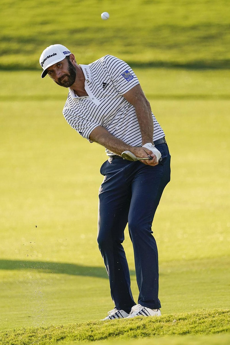 Dustin Johnson chips to the 18th hole green during the third round of the PGA Tour Championship on Sunday at East Lake Golf Club in Atlanta. Johnson shot a a 6-under 64 to take a five-stroke lead going into today’s final round.
(AP/John Bazemore) story.lead_photo.caption