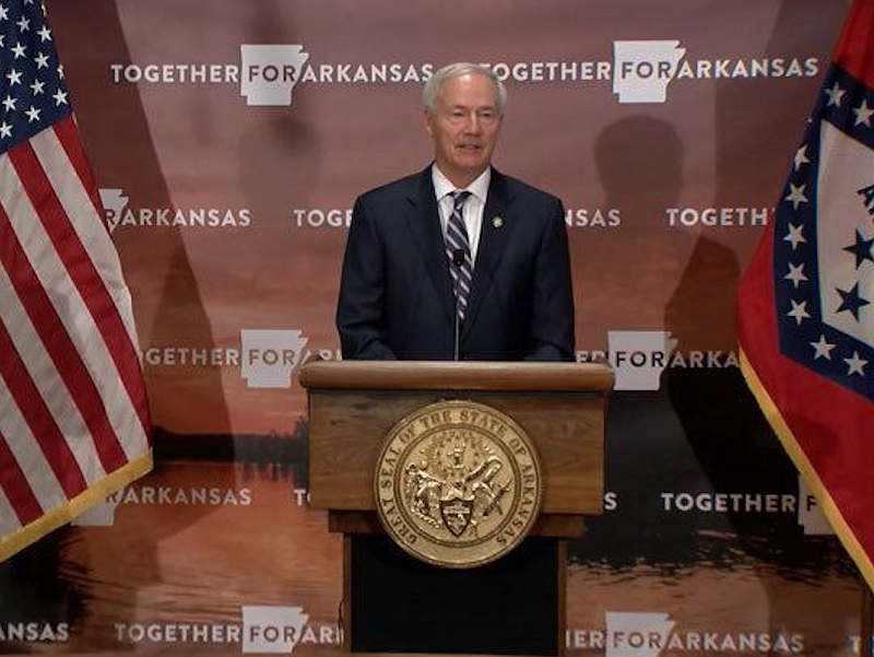 Arkansas Gov. Asa Hutchinson speaks to reporters at the state Capitol in Little Rock on Tuesday in this still of video provided by the governor's office. 