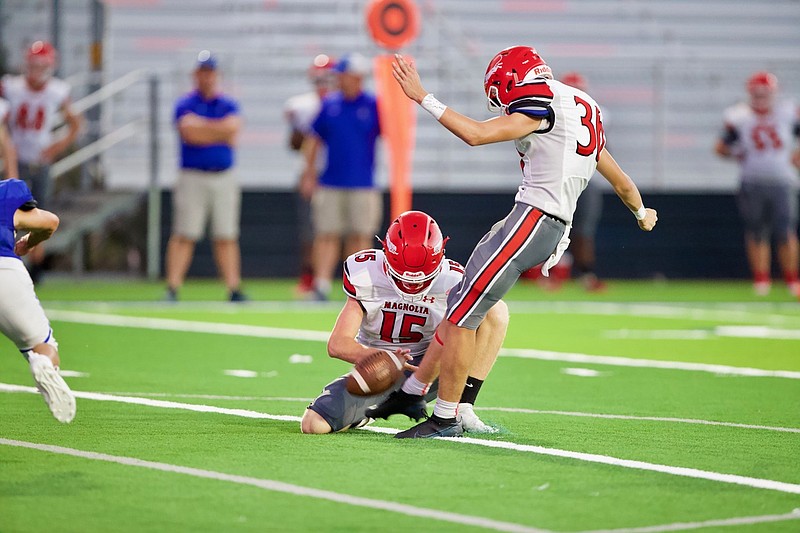 Magnolia junior Jay Todd Baker (36) kicks a field goal while senior quarterback Tanner Nielsen holds. The Panthers (1-1) will travel to Little Rock Christian Friday night to face the Warriors (2-0).