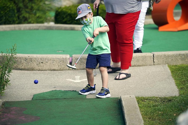 Declan Aubin, 5, shows his form Monday at Bakers Golf Center in Lanesborough, Mass. (AP/The Berkshire Eagle/Ben Garver)