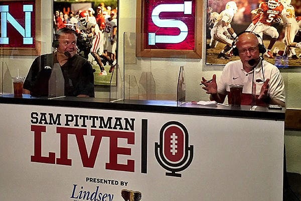 Arkansas coach Sam Pittman (left) and radio announcer Chuck Barrett are shown during Pittman's radio show Wednesday, Sept. 9, 2020, in Fayetteville.