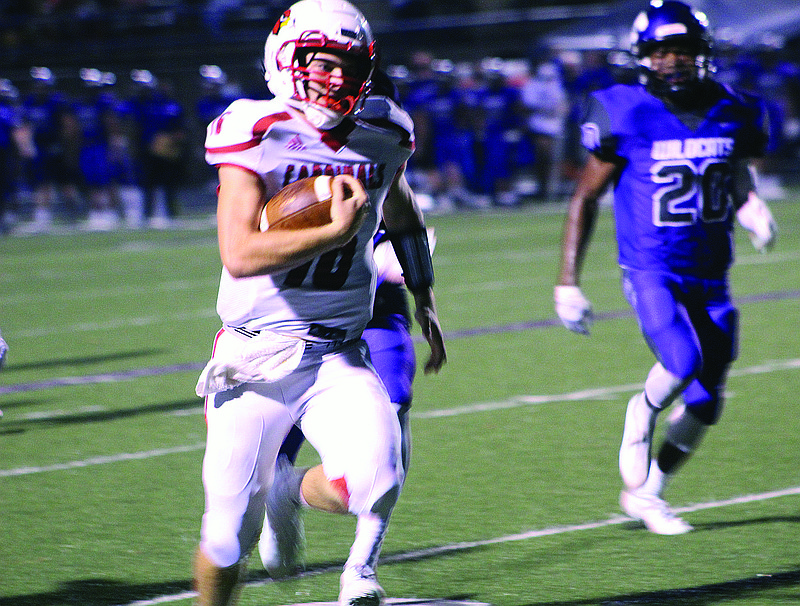 Camden Fairview quarterback Logan Robertson gets loose for a 52 yard touchdown run. The Cardinals won 45-20 story.lead_photo.caption
