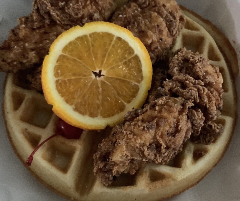 The chicken and waffles for brunch at 42 bar and table comes with maple syrup and some house-made hot sauce.
(Arkansas Democrat-Gazette/Eric E. Harrison)