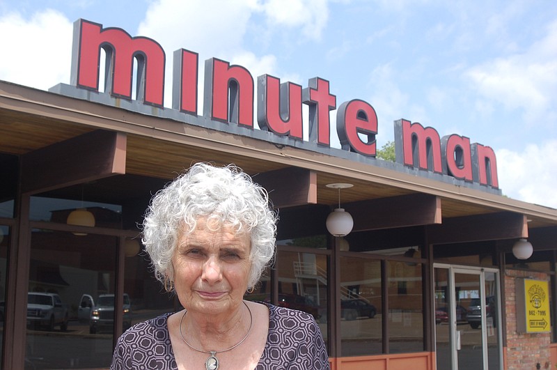 Linda McGoogan stands in front of her El Dorado Minute Man, which until Friday, when a new Minute Man opens in Jacksonville, was the last survivor of a nearly 60 restaurant, three-state chain.
(Democrat-Gazette file photo/Stephen Steed)