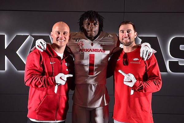 Arkansas receivers coach Justin Stepp, Razorbacks commit Ketron Jackson, and offensive coordinator Kendal Briles.