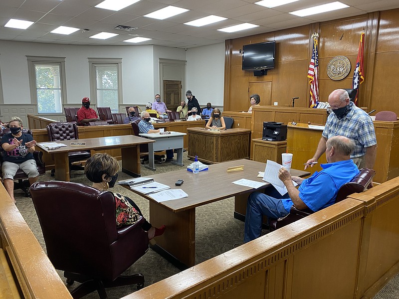 Members of the Columbia County Quorum Court exchanged pleasantries before the meeting began. Court members wore masks when social distancing was not applicable, with few taking off their face coverings to speak when the meeting began.