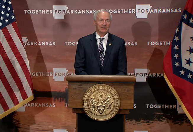 Arkansas Gov. Asa Hutchinson speaks to reporters at the state Capitol in Little Rock on Thursday in this still of video provided by the governor's office. 
