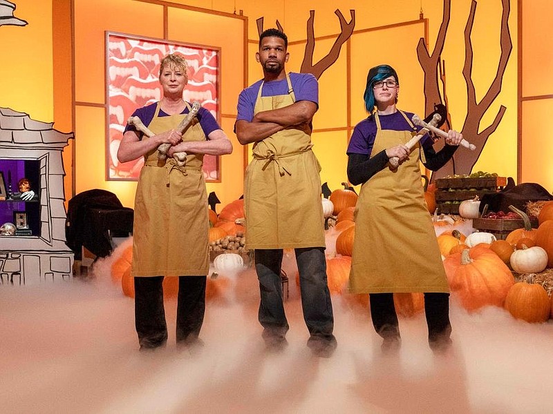 Cake artist Sam Lucero (right), owner of of Anarchy Cake Studio in Rogers, is part of team Ghouly Goblins with Sharon Hauht (left) and Steve Baity on the Food Network series "Halloween Wars," which airs Sunday at 8 p.m.

