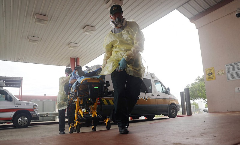 FILE - In this July 28, 2020, file photo, a man arrives at Starr County Memorial Hospital in Rio Grande City, Texas. The number of daily U.S. deaths from the coronavirus is declining again after peaking in early August, but scientists are warning that a new bout with the disease this fall could claim more lives. (AP Photo/Eric Gay, File)

