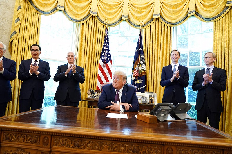 President Donald Trump speaks in the Oval Office of the White House in Washington on Friday, Sept. 11, 2020, to announce that Bahrain has agreed to normalize ties with Israel. The move is part of a broader diplomatic push by Trump and his administration to fully integrate the Jewish state into the Middle East. Joining the president are (from left) U.S. Ambassador to Israel David Friedman, Treasury Secretary Steven Mnuchin, Vice President Mike Pence, Jared Kushner and Brian Hook, the U.S. special envoy for Iran.