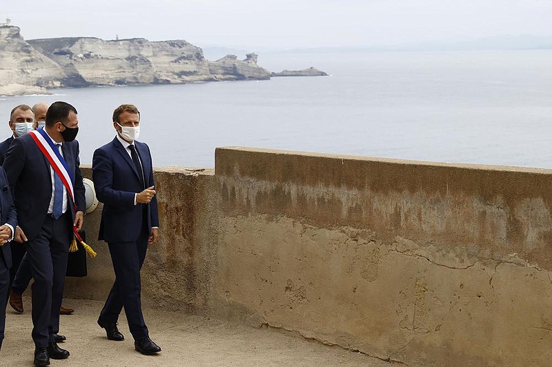 French President Emmanuel Macron (right) and Bonifacio Mayor Jean Charles Orsucci tour the town on Corsica on Thursday. “Turkey is no longer a partner in this region,” Macron told reporters ahead of the island summit of European Union leaders.
(AP/Ian Langsdon)