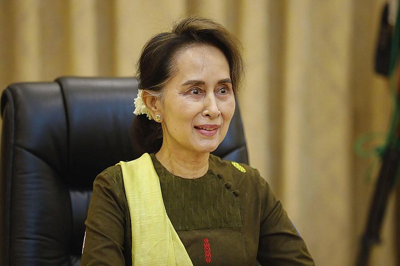 In this handout image provided by the Myanmar State Counsellor Office, Myanmar leader Aung San Suu Kyi is shown while she attends a video conference, Friday, July 3, 2020, in Naypyitaw, Myanmar. 
 (Myanmar State Counsellor Office via AP)