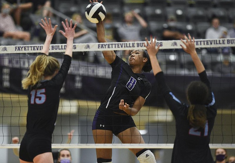 Fayetteville Rosana Hicks (8) spikes the ball, Thursday, September 10, 2020 during a volleyball game at Fayetteville High School in Fayetteville. Check out nwaonline.com/200911Daily/ for today's photo gallery. 
(NWA Democrat-Gazette/Charlie Kaijo)