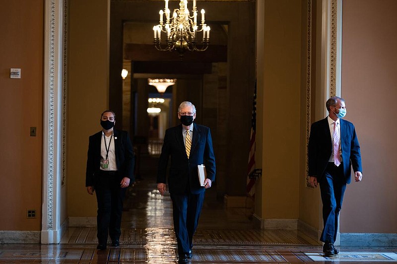 Senate Majority Leader Mitch McConnell heads to the Senate chamber Thursday morning.
(The New York Times/Anna Moneymaker)