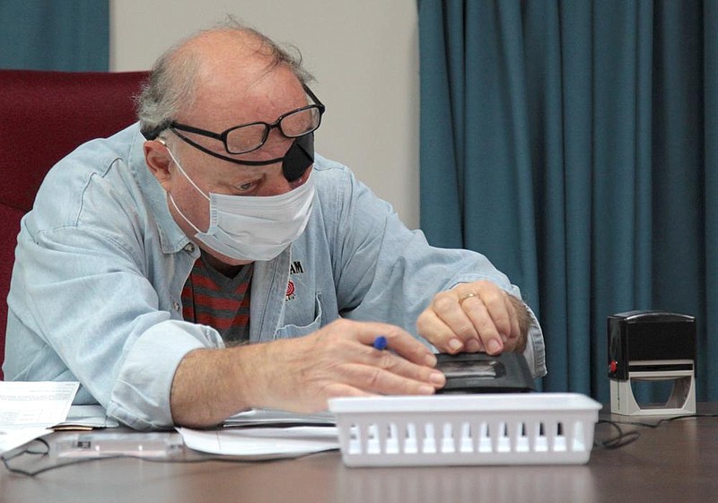 Jefferson County Election Commissioner Stuart “Stu” Soffer prepares to record the commission meeting Thursday night, Sept. 10, 2020. Two Pine Bluff aldermen and a candidate for City Council were on hand at the meeting to raise objections to the closing of the New Town polling site in Ward 4. 
(Pine Bluff Commercial/Dale Ellis)